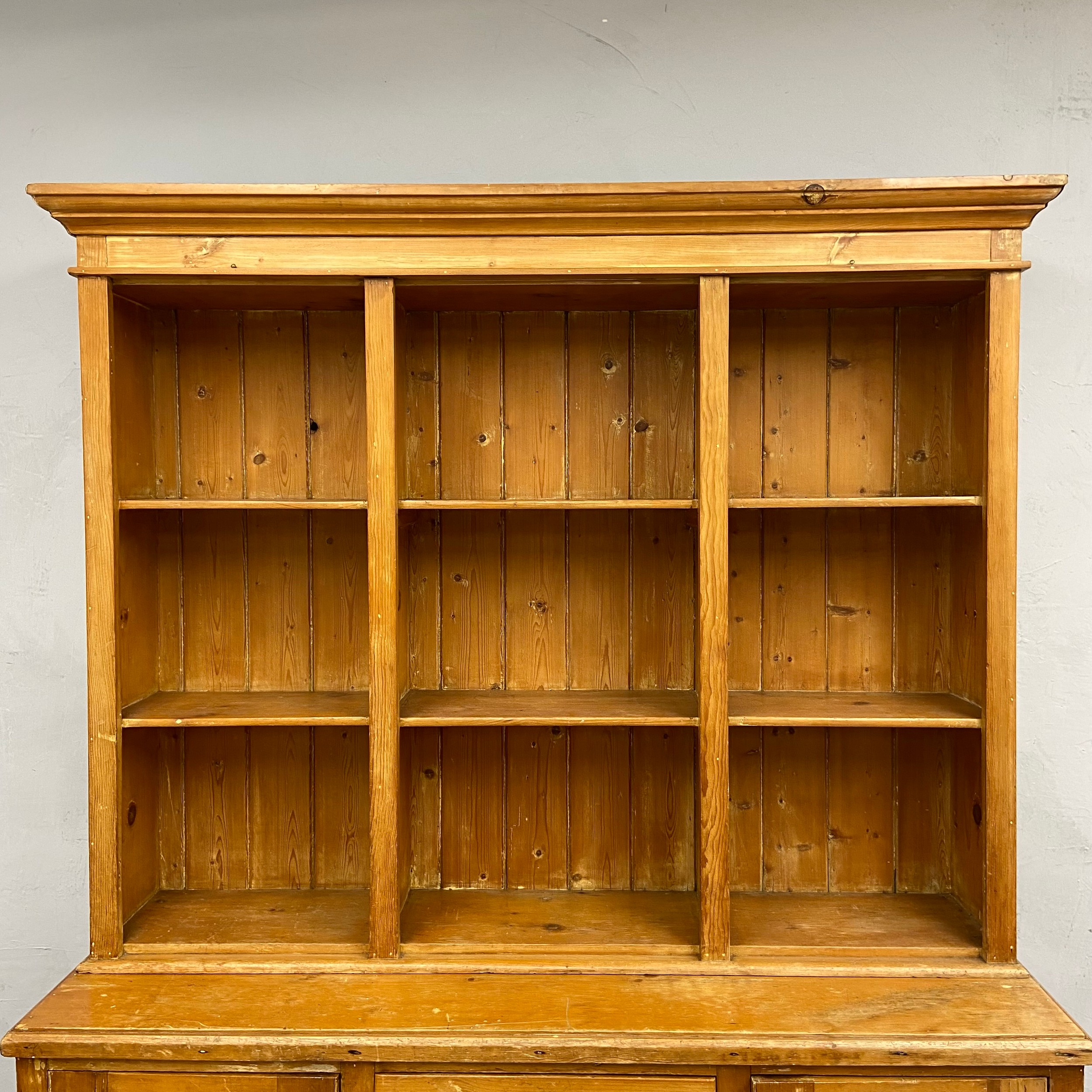 A C.1900 pine dresser in two parts with three shelves over base cabinets and drawers raised on bun - Image 3 of 5