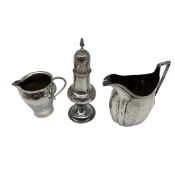 An Arts & Crafts hammered sterling silver creamer by Birmingham Guild of Handicraft Ltd, 1903