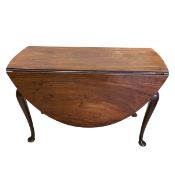A Georgian mahogany drop leaf dining table with circular figured top raised on cabriole supports