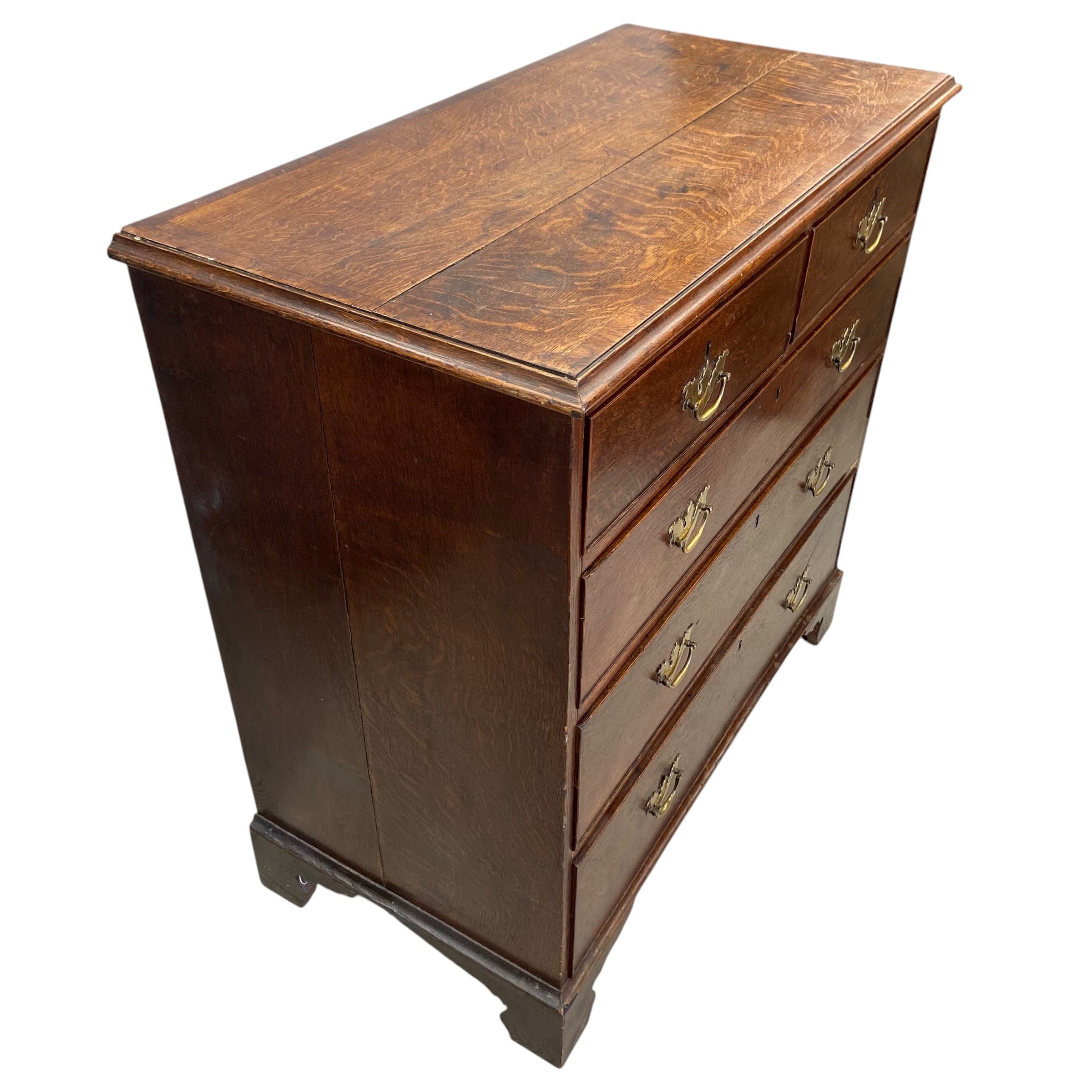 A Georgian oak chest of two short over three long cockbeaded drawers raised on bracket supports. H. - Image 4 of 4
