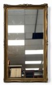 A large gilt framed mirror with bevelled plate. H.172 W.98cm