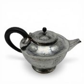 An Arts & Crafts hammered sterling silver teapot by Birmingham Guild of Handicraft Ltd, 1901 with