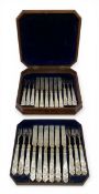 A Victorian hallmarked sterling silver dessert cutlery service with carved mother-of-pearl handles