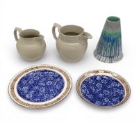 Two 19th century Minton ring turned ceramic jugs with figural mask spouts and scrolled handles