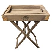 A contemporary promotional campaign style weathered teak butler's tray table with nest of three