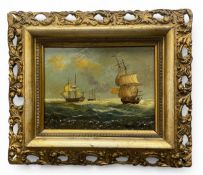 A 20th century oleograph depicting sailing ships at sea. Signed bottom right in a gilt openwork