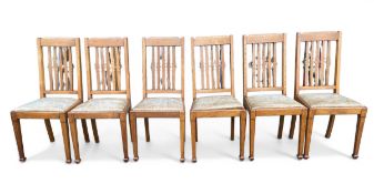 A set of six C.1900 oak Arts & Crafts dining chairs each with shaped slatted back over the faux