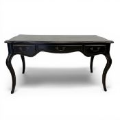 A contemporary ebonised writing desk in the French Louis XV style with thumb-moulded quatrefoil