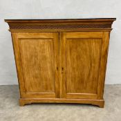 A 19th century sideboard with matched black plate glass top over the carved latticework frieze above
