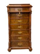 A 20th century walnut Wellington or 'day of the week' chest having a fluted caddy top over seven