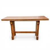 A C.1900 Arts & Crafts extending oak dining table with fold over plank top raised on shaped and