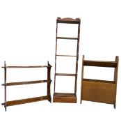 A 20th century Arts & Crafts style magazine rack together with wall mounted and floor standing