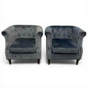 A pair of contemporary dark grey velour upholstered Chesterfield button-back club armchairs raised