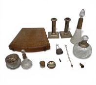 A mixed lot of hallmarked sterling silver and white metal to include cut glass decanters and perfume