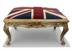 A vintage 19th century style footstool with calico upholstered Union Jack seat raised on carved