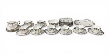 A 1920s Art Deco Shelley 'Black Trees' pattern part tea service to include eight cups and saucers, a