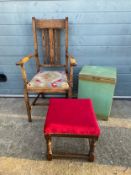 An early 20th century Arts & Crafts style oak armchair together with a Lloyd Loom style linen basket