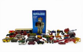 A mixed lot of vintage toys to include a battery operated Space Walk Man in original box together
