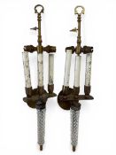 A pair of early 20th century Italian wall sconces each with a gilt metal stem over a pair of