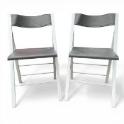 A pair of contemporary Italian folding Arrmet 'Pocket' dining chairs with moulded plastic backs