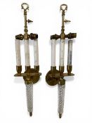 A pair of early 20th century Italian wall sconces each with a gilt metal stem over a pair of