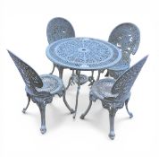 A vintage painted and weathered openwork aluminium garden table and four chairs in the manner of