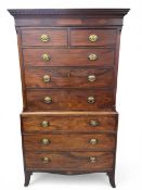 A Georgian mahogany chest on chest with dentil moulded cornice over two short and three long figured