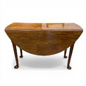 A Georgian mahogany drop-leaf dining table with circular figured top raised on cabriole supports