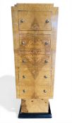 A contemporary Art Deco style pale burr elm tallboy chest of five graduating, quarter veneered