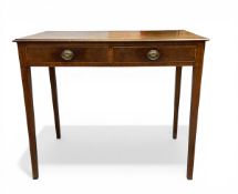 A Georgian mahogany side or writing table with thumb-moulded top over two satinwood strung frieze