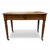 A 19th century mahogany writing table with gilt and tooled tan leather top over two frieze drawers