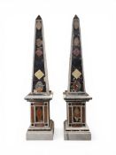 A pair of full height 19th century Grand Tour style Italian specimen marble obelisks raised on