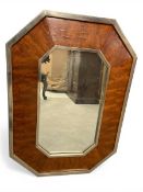 A vintage Art Deco style wall mirror with octagonal plate in a brass and figured mahogany frame.
