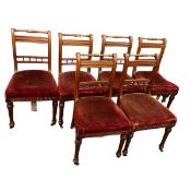 A set of six late 19th century walnut bar-back dining chairs with turned top rails and spindle