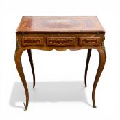 A French walnut Louis XV style writing desk with marquetry inlaid fall front enclosing a baize lined