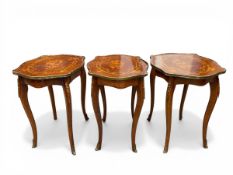 A set of three French marquetry inlaid mahogany side tables each having a quarter veneered