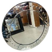 A large contemporary Venetian style sorcerer's wall mirror with circular bevelled plate in a