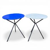 A pair of vintage modernist style side tables with circular laminate tops raised on splayed tripod