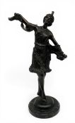 A 20th century Art Deco bronze figure raised on a circular marble plinth base after the original
