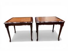 A pair of vintage mahogany side tables each with a gilt and tooled tan leather top and scalloped
