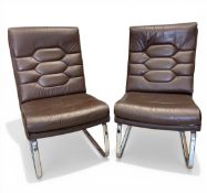 A pair of vintage brown leather upholstered Verco lounge chairs raised on bent chrome supports