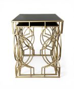 A nest of two contemporary Hollywood Regency style side tables each with square smoked glass top