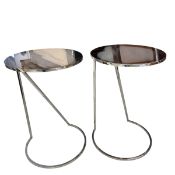 A pair of contemporary polished chrome side or occasional tables with circular tops raised on