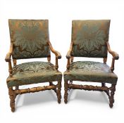 A pair of French Louis XIV style carved walnut fauteuil armchairs with reupholstered back and seat