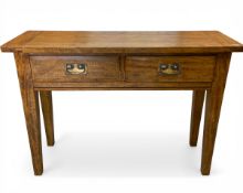 A contemporary hardwood side or console table in the Georgian style with plank top over two frieze