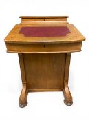A 19th century walnut davenport with marquetry inlaid pen box over the burgundy leather lined