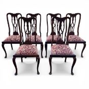 A set of six Chippendale style mahogany dining chairs each with shaped back and carved openwork