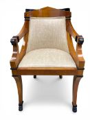 A vintage Spanish Biedermeier-style satinwood birch carver armchair having a pitched top-rail and