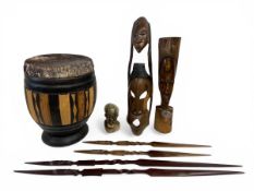 A mixed lot of vintage African tribal carvings to include a djembe drum, a carved hardwood mask