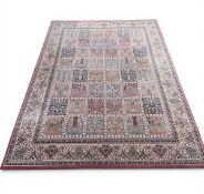 A contemporary Kashmiri style Bakhtiari carpet with allover polychrome panel field over a beige